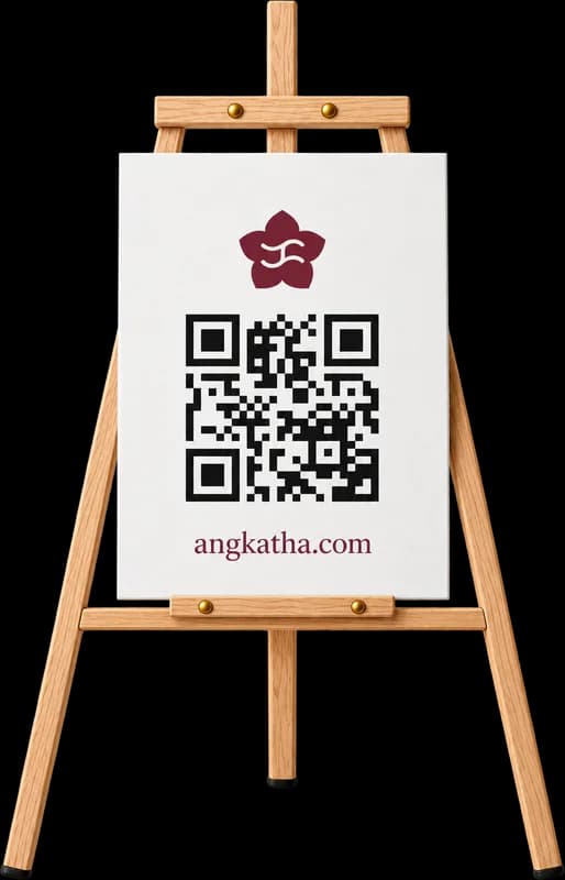 A printed Kathā QR sign on a wooden easel, the kind that stands at the reception entrance